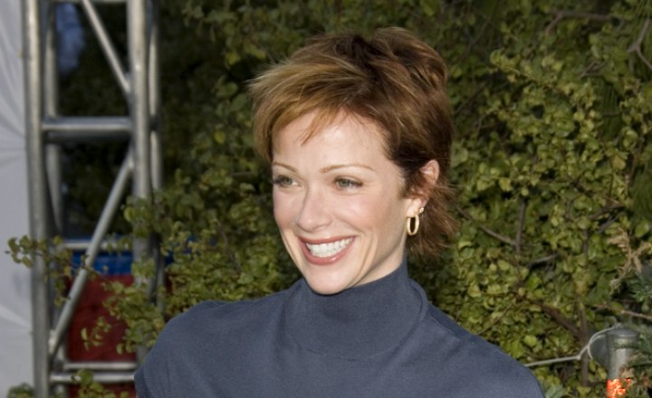 Lauren Holly sporting a boyish short haircut