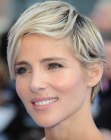 Elsa Pataky wearing a longer pixie hairstyle with multi tonal hair coloring