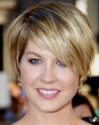 Jenna Elfman's blonde pixie cut with a long side fringe