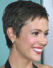 Alyssa Milano wearing a no fuss pixie haircut that shows off her beautiful features