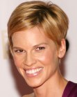 Hilary Swank wearing a pixie haircut that looks feminine