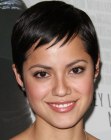 Sylvia Brindis rocking a pixie styled with her hair parted off to the side
