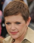 Natalie Maines with her hair cut in a very short pixie style