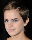 Emma Watson with her hair cropped in a sophisticated pixie cut