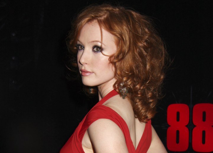 Alicia Witt with medium long curly red hair