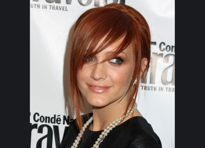 Ashlee Simpson wearing her red razor-cut hair in an up-style