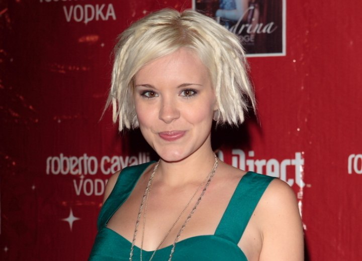 Brea Grant with white platinum hair in an A-line bob
