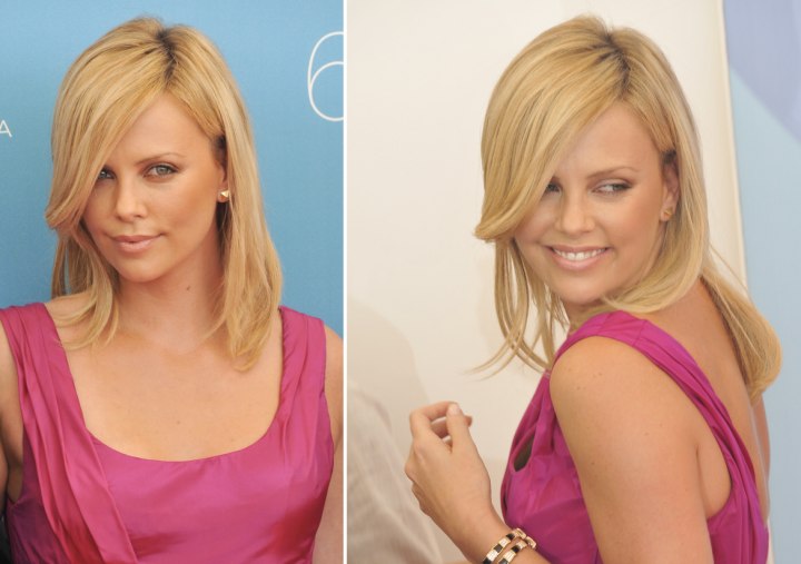 Charlize Theron with her long smooth hair combed to one side