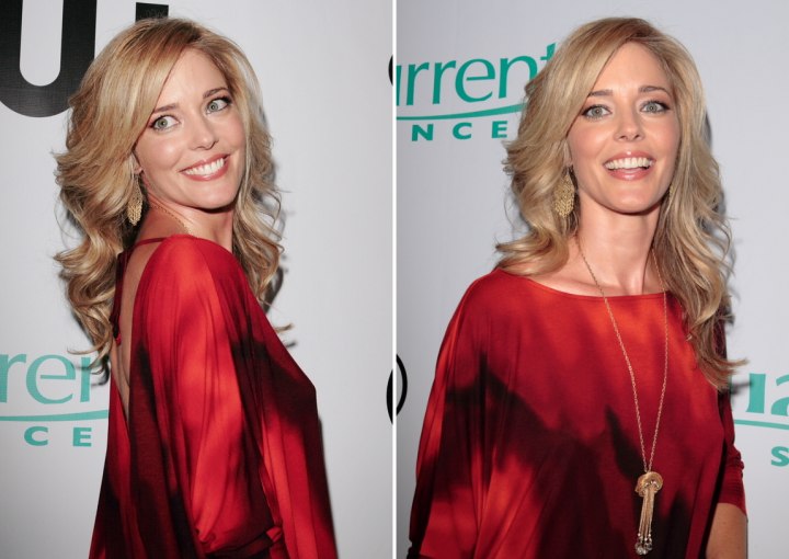 Side view of Christina Moore's long curly hairstyle