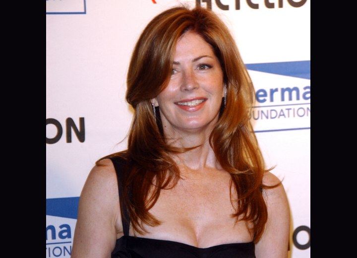Dana Delany wearing a long layered hairstyle
