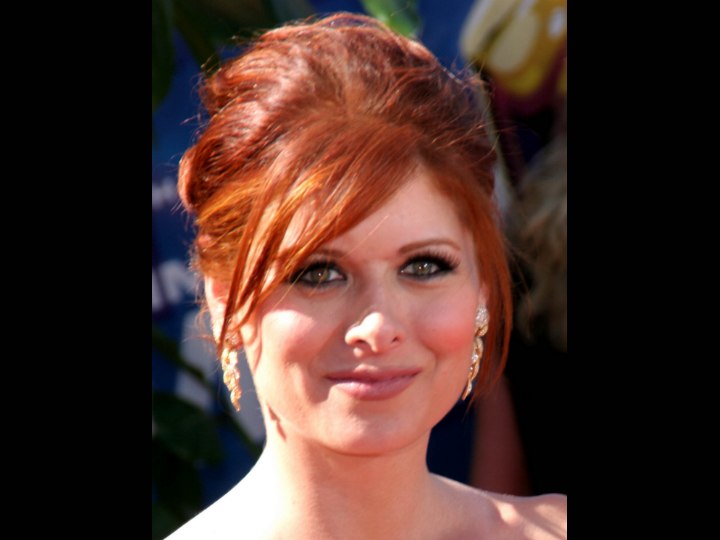 Debra Messing's red hair styled up