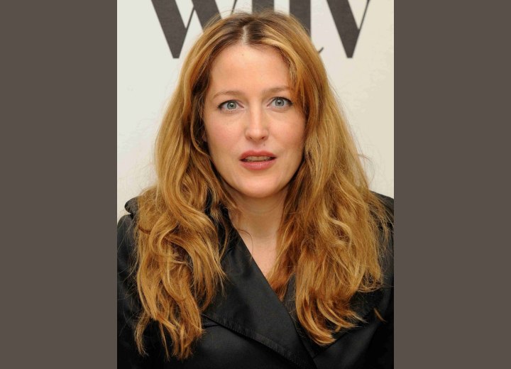 Gillian Anderson's long hair with waves below the neckline