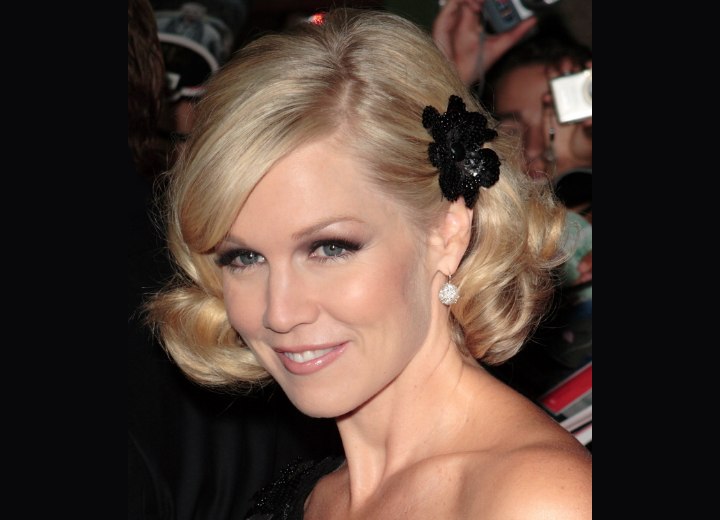 Jennie Garth - Curled hairstyle with a hair ornament