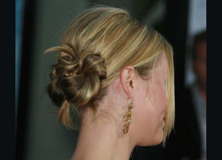 Julia Stiles wearing her hair pinned to the back