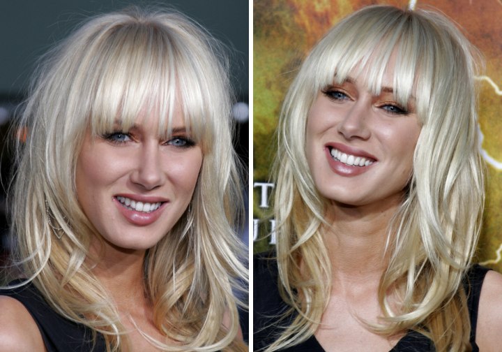 Kimberly Stewart with platinum blonde hair and long bangs