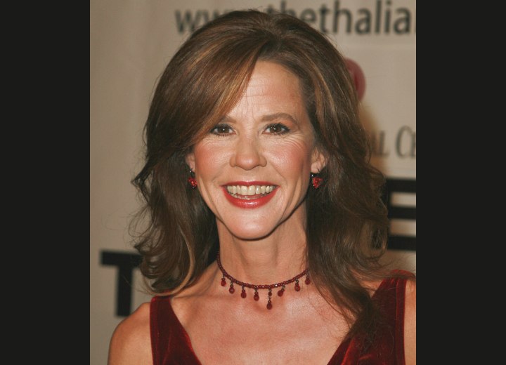 Linda Blair's long hairstyle with large rolled curls