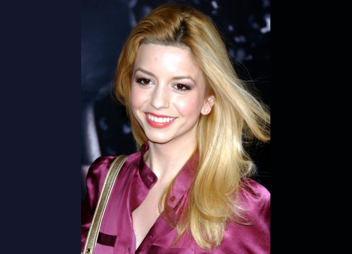 Masiela Lusha's long hair with an airy feel and shiny silk blouse