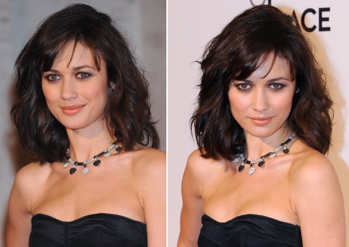 Olga Kurylenko wearing carefree shoulder touching hair