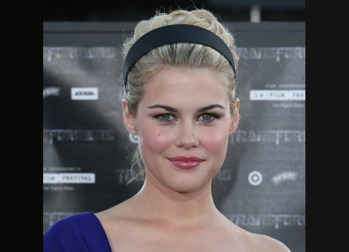 Rachael Taylor wearing her curly hair in a ponytail
