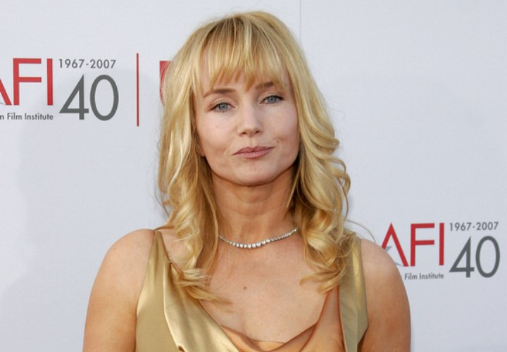 Rebecca de Mornay with long curled hair