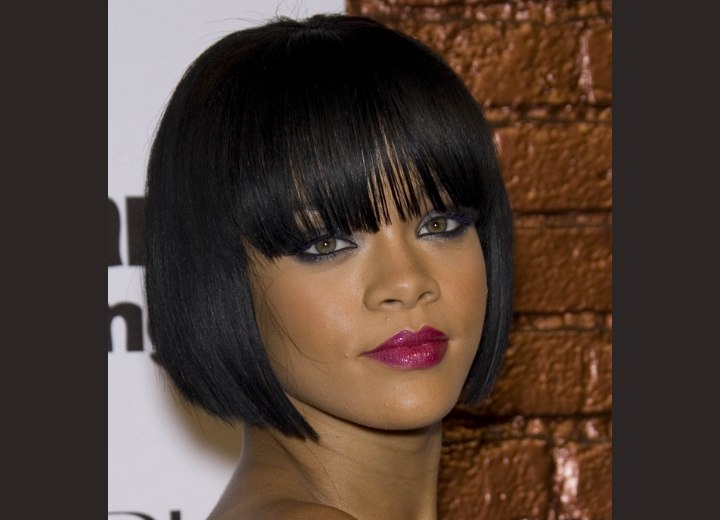 Rihanna with her hair cut in a short bob
