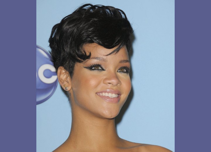 Rihanna with her hair cut up high in the back