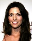 Brunette Alana De La Garza wearing her hair below the shoulders and with layers