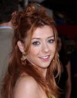 Alyson Hannigan wearing her red hair in a partial up-style