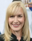 Angela Kinsey's long hairstyle with angled sides and below the eyebrows bangs