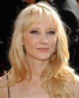 Anne Heche wearing her blonde hair long with layers and short bangs