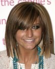 Ashlee Simpson wearing her hair in a medium long blunt cut bob with bangs