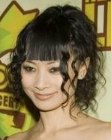 Bai Ling sporting a feminine updo hairstyle with curls