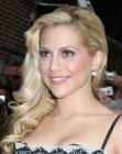 Brittany Murphy wearing her curled hair long and pulled to one side