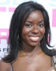 Camille Winbush wearing her black hair long with ends that flip up