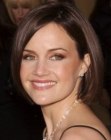 Carla Gugino's sleek side-parted with her hair behind one ear