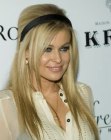 Carmen Electra wearing her hair long and kept in place with a head band