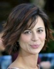 Catherine Bell wearing her hair in a middle of the neck bobwith layers