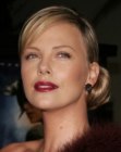 Charlize Theron with her hair in a retro Greta Garbo updo