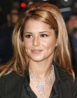 Cheryl Cole with her long hair cut into layers and straightened with a flat iron