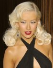 Christina Aguilera with her bleached hair curled and styled for a 1950s look