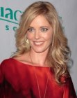 Christina Moore wearing her hair with curls that plunge below her shoulders