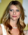 Claire Danes sporting a long summer hairstyle with curls and waves