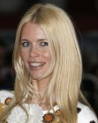 Claudia Schiffer with her long blonde hair cut into long layers