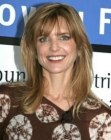 Courtney Thorne-Smith with her hair cut in a long low maintanence style with bangs