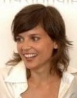 Brunette Elena Anaya with her medium length hair cut into a shag style