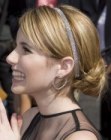 Emma Roberts with her hair in  a chignon