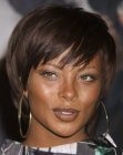 Eva Marcille wearing her hair in a short meckline-length shag