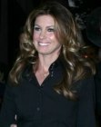 Faith Hill with her long layered hair styled into curls