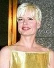 Geena Davis with short platinum blonde hair and long bangs