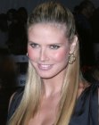 Heidi Klum with her sleek hair styled up partially